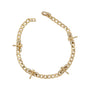 Gold chain bracelet with diamond accents on a white background