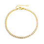 Gold bracelet with clear stones on a white background