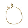 Gold beaded bracelet with a small gold charm on a white background