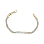 Gold bracelet with diamond accents on a white background