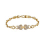 Gold bracelet with a decorative clasp on a white background