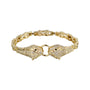 Gold bracelet with panther head designs on a white background