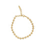 Gold beaded bracelet on a white background