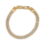 Gold bracelet with diamond accents on a white background