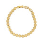 Gold heart-shaped bracelet on a white background