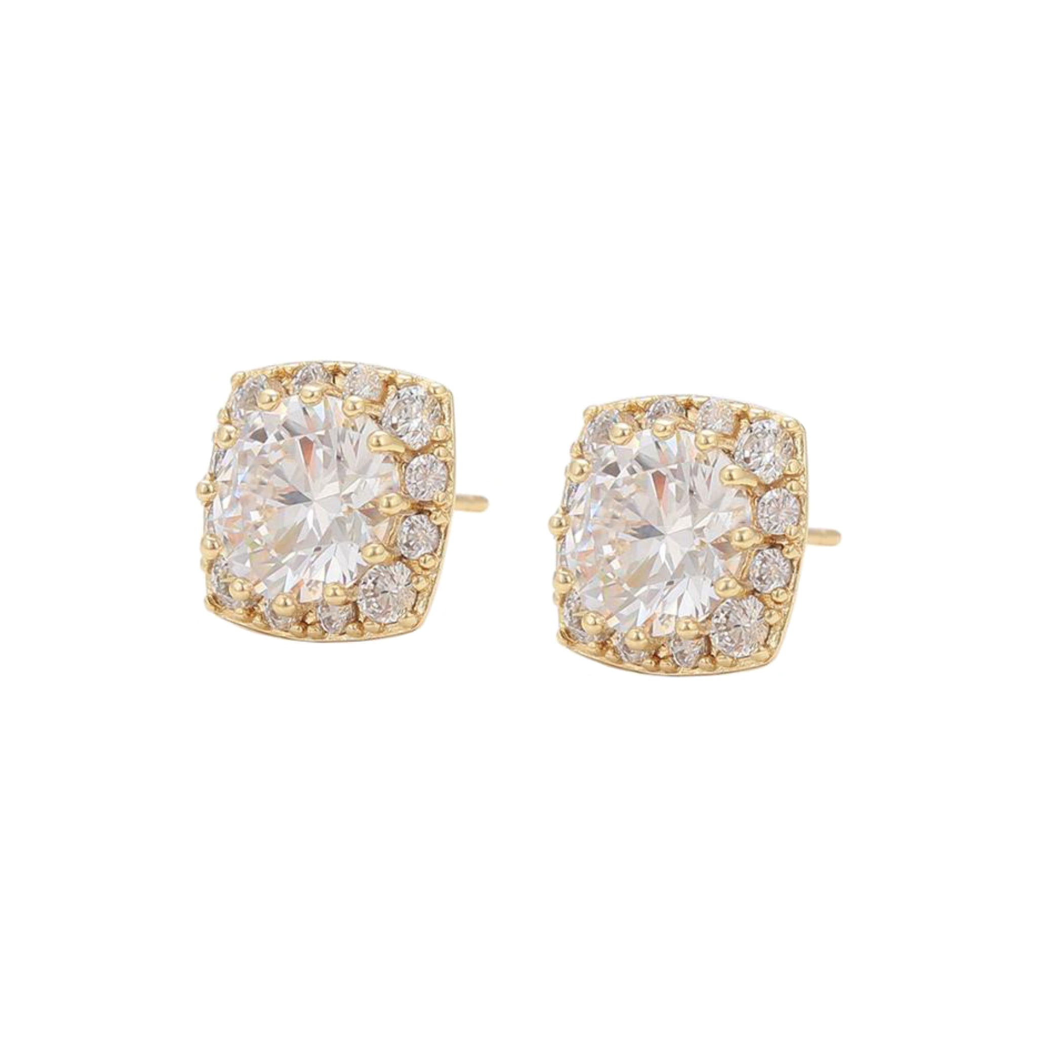 Gold earrings with large clear gemstones on a white background