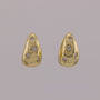 Pair of gold earrings with diamond accents on a gray background