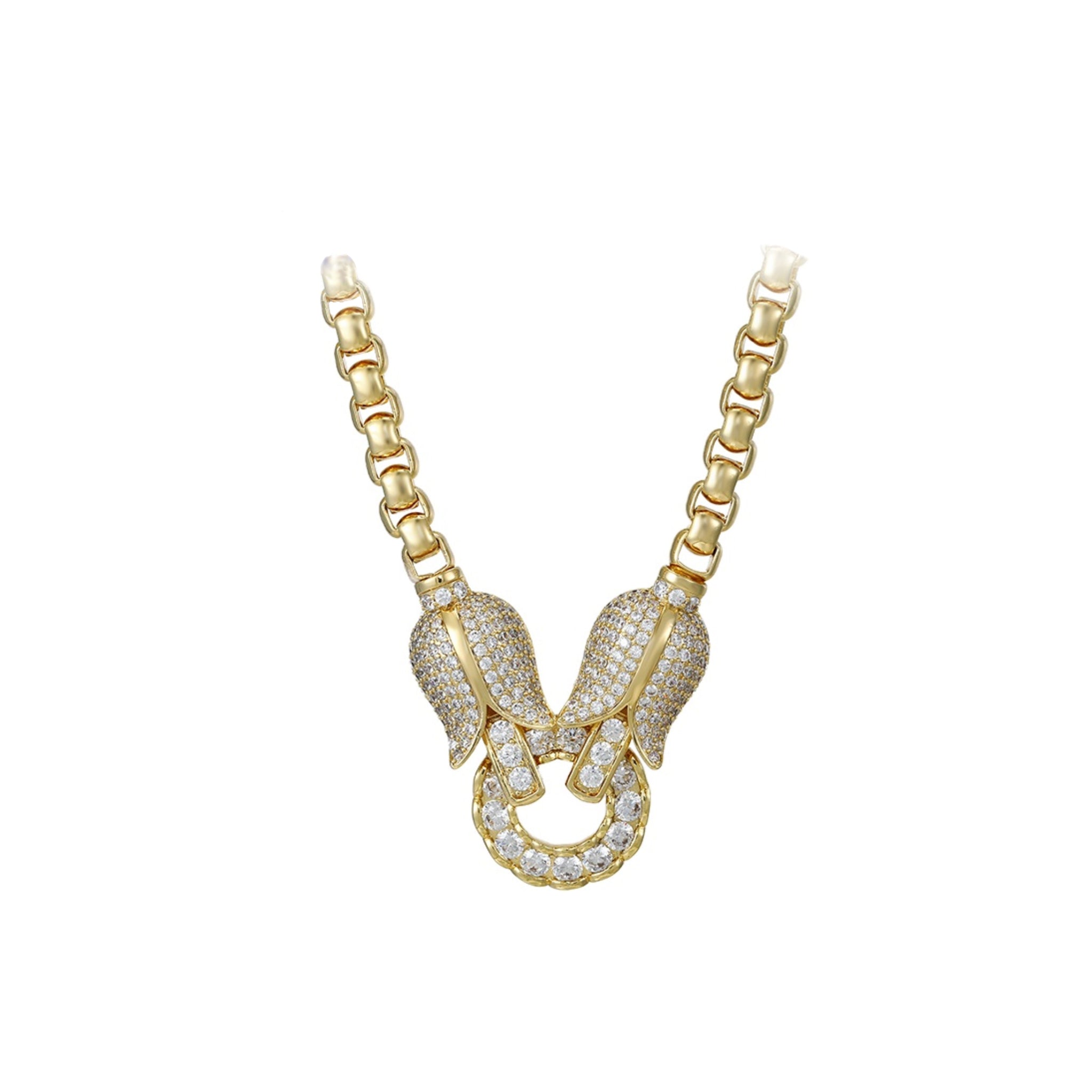 Gold necklace with a intricate pendant on a white background