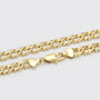 Gold chain bracelet with a clasp on a light gray background