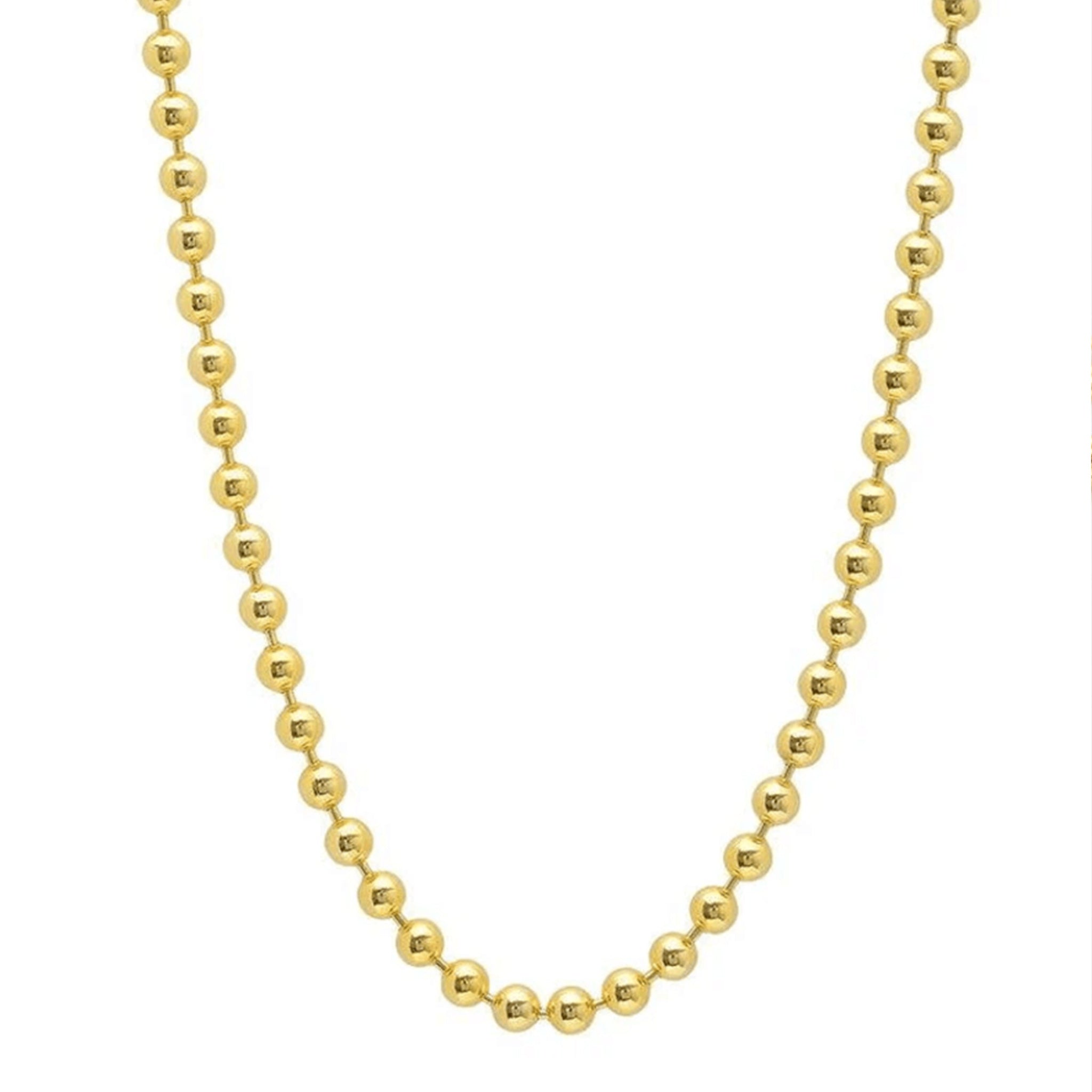Gold beaded necklace on a white background
