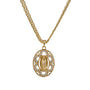 Gold necklace with a pendant featuring a religious design on a white background