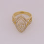 Gold ring with diamond accents on a light gray background