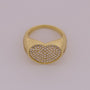 Gold ring with a heart-shaped diamond pavé setting on a light gray background