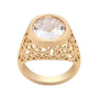Gold ring with a large crystal center stone on a white background
