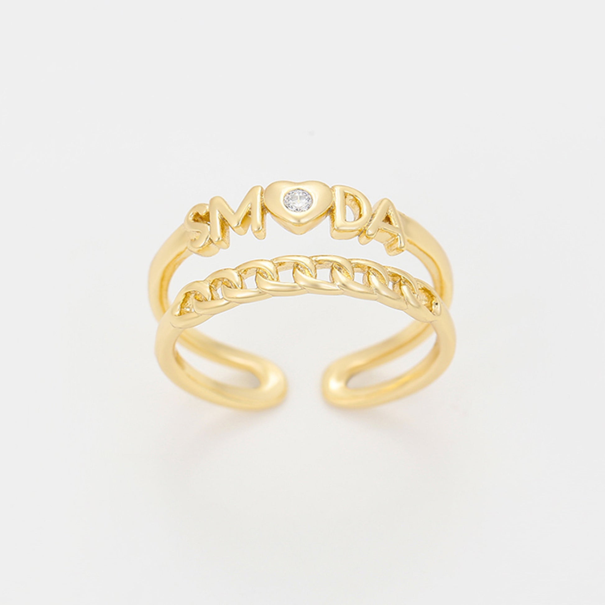 Gold ring with 'LOVE' and 'MOM' text on a light gray background