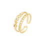 Gold open ring with a small diamond on a white background