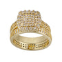 Gold ring with diamond accents on a white background