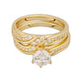 Gold ring with diamond accents on a white background
