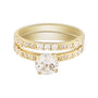 Gold ring with a diamond on a white background